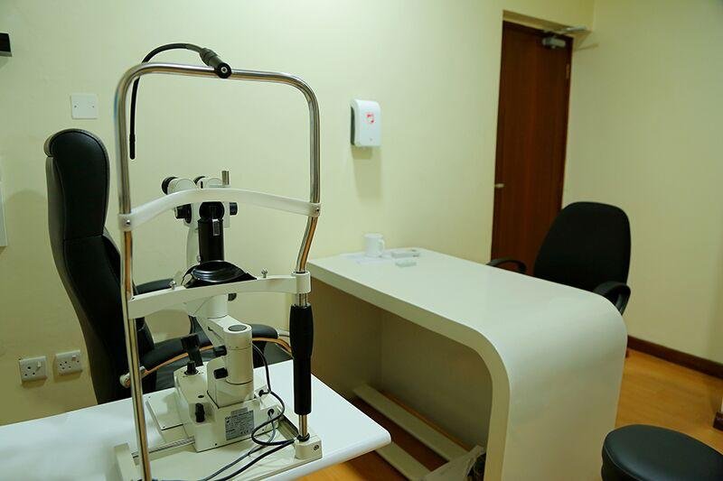Eye specialist examining a patient at ASJ Eye Hospital